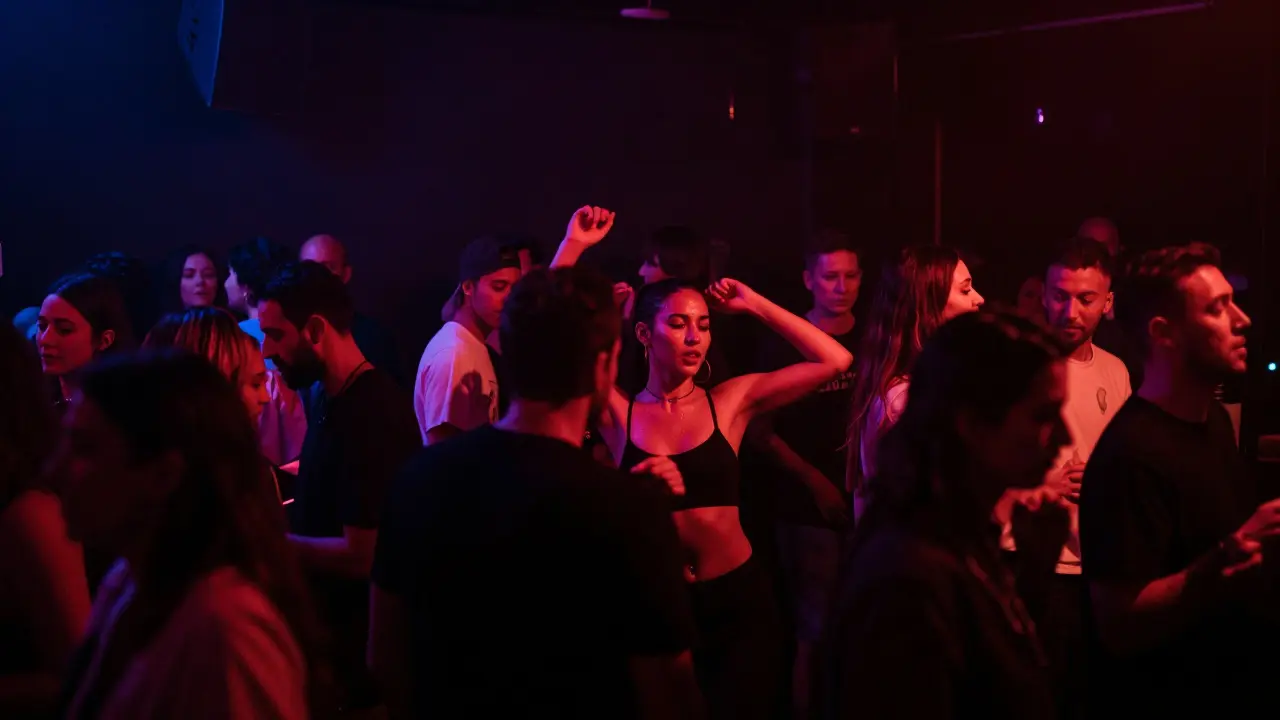 People lost in rhythm inside the dim, intimate Karma nightclub